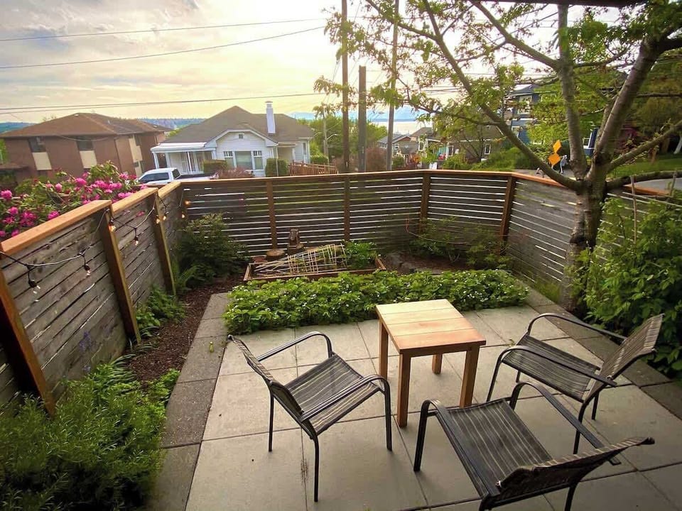 Relax from the private back yard patio with west-facing views of Olympic mountains and Elliott Bay