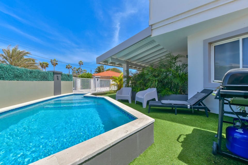Relax by the pool or enjoy outdoor dining at the BBQ area
