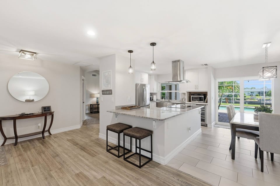 The beautiful, updated kitchen combines modern style with an open layout, making it easy to connect while cooking, dining, or planning the day ahead.