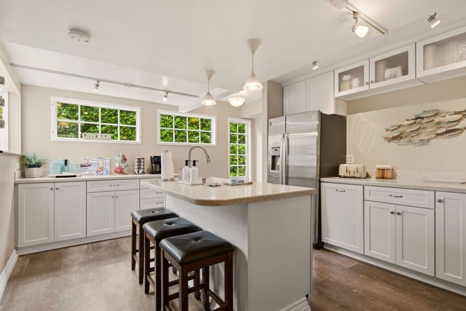 A coffee bar and island seating to relax together in the mornings.