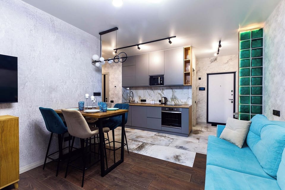 Luxury Apartment, Balcony, City View | Living area | 42-inch Smart TV with cable channels