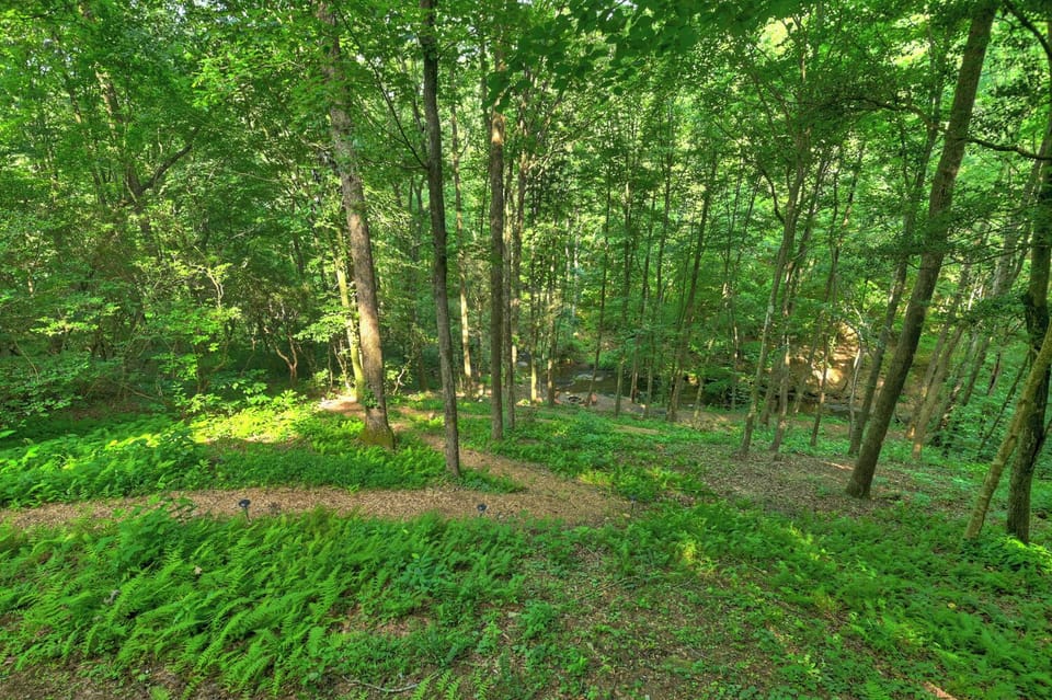 Follow the winding path to your private creekside firepit, where evenings under the stars make this North Georgia mountain cabin rental the perfect family getaway
