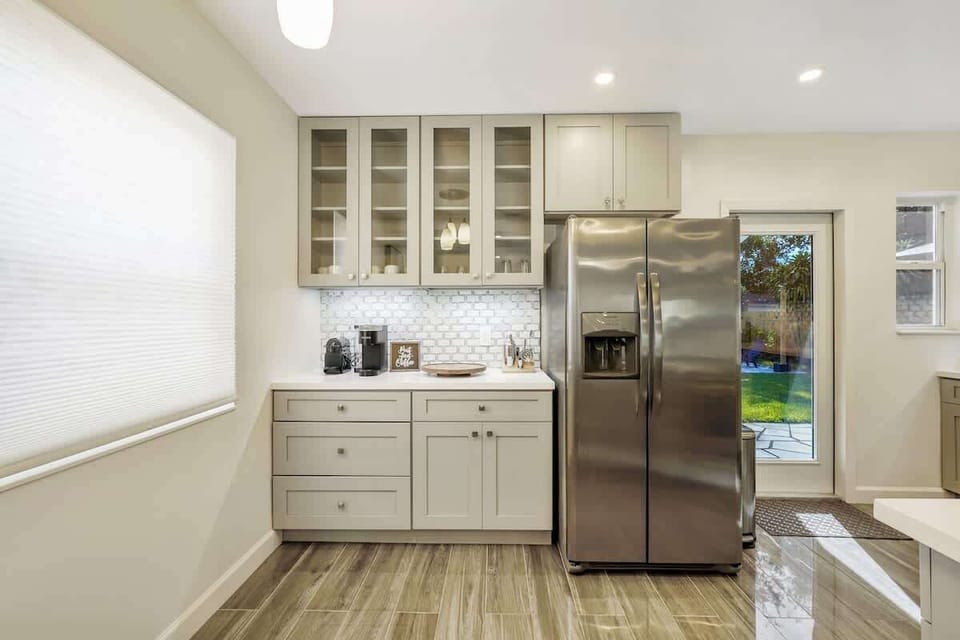 coffee station right beside the refrigerator