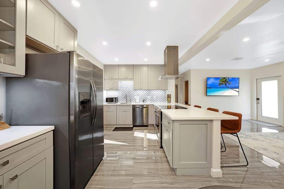 kitchen is equipped with coffee maker, basic cookware and silverware