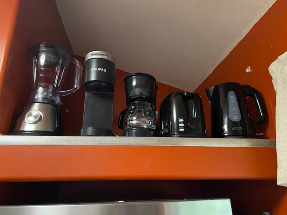Enjoy the convenience of a complete drink station featuring a Keurig, Mr. Coffee brewer, blender, toaster, and electric tea kettle- perfect for every guest preference. 