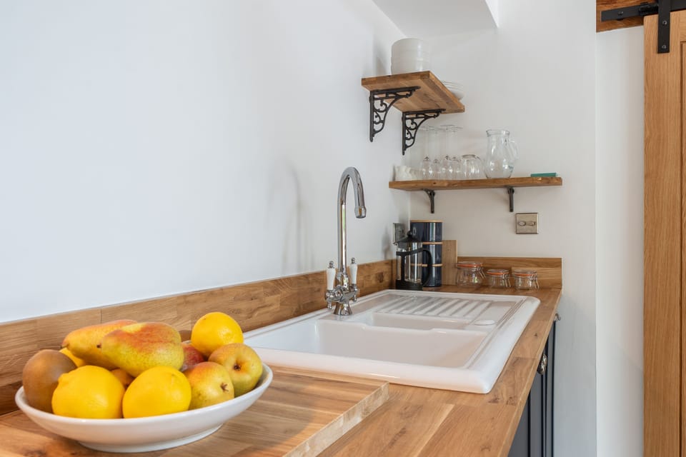 Bakers Barn, Stoford: The kitchen has solid timber worktops