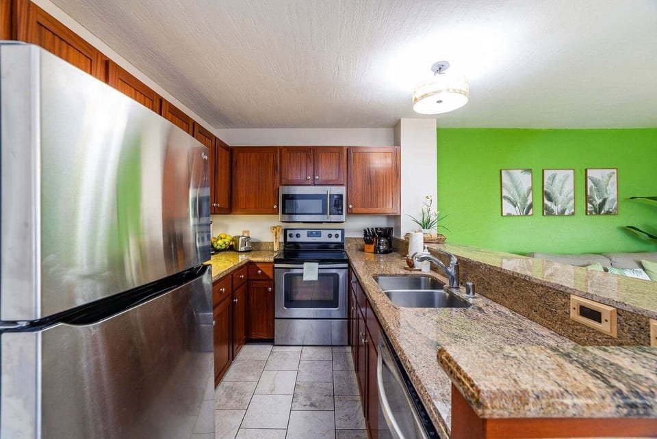 Full kitchen includes fridge, oven, dishwasher, microwave, coffee maker, toaster, electric water kettle, rice maker, blender. Starter supplies of basic items including trash bags, dishwasher pods, dish soap, hand soap.
