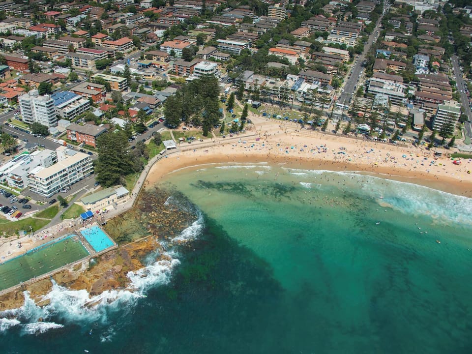 Stunning beachside setting with ocean pools, sandy shore, and walkable surrounds