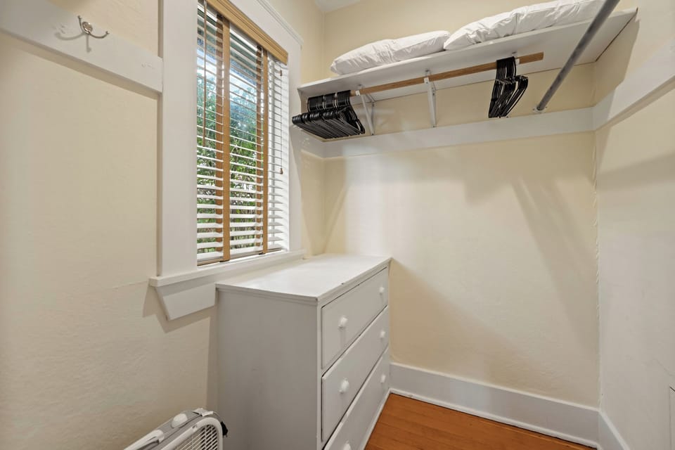 Walk-in closet with dresser
