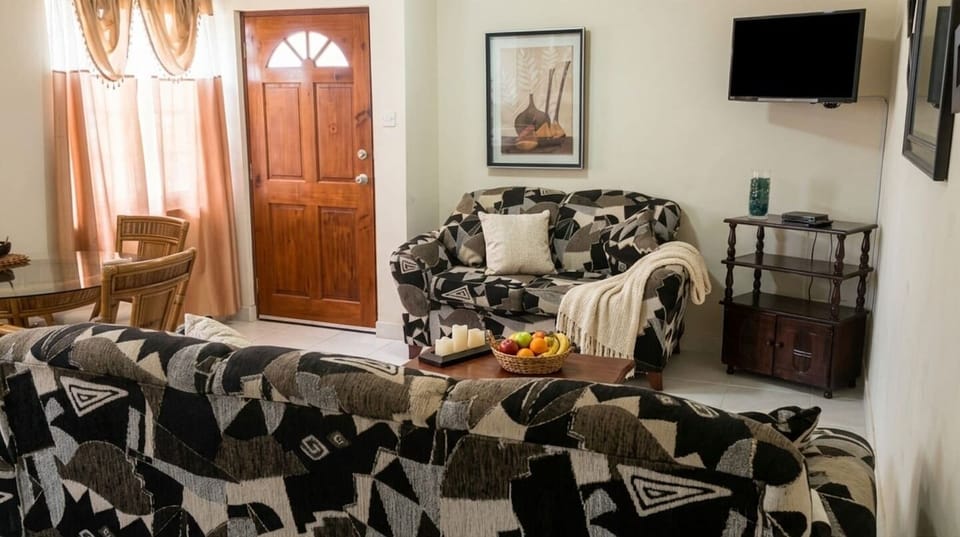 Bright and inviting living area with Smart TV, dining space, and comfortable seating for relaxation