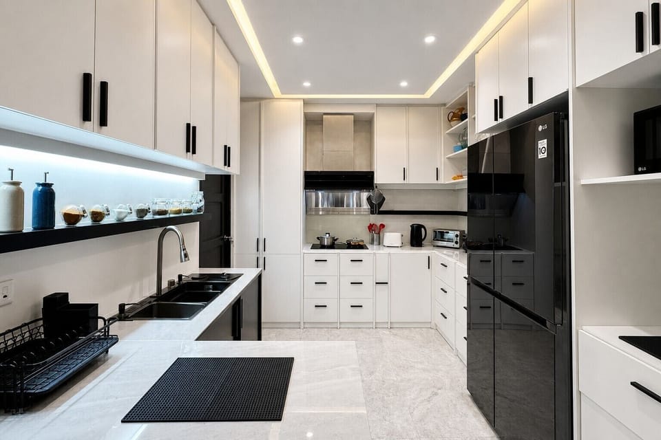 【Full Kitchen】A full U-shaped kitchen with a huge two-door LG fridge, induction cooking, and real counter space to prep on. Stocked with pots, pans, and utensils for cooking a proper meal for the group.