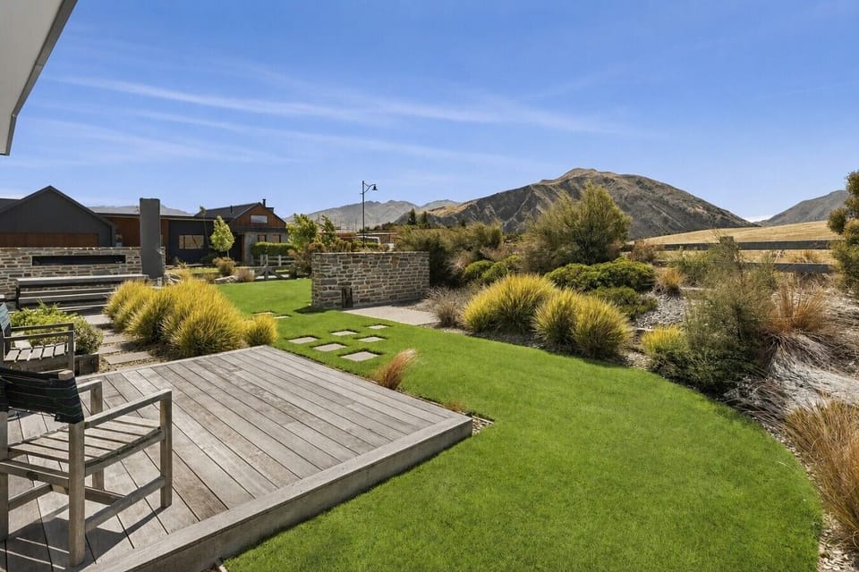 Private backyard with sunny deck and mountain views