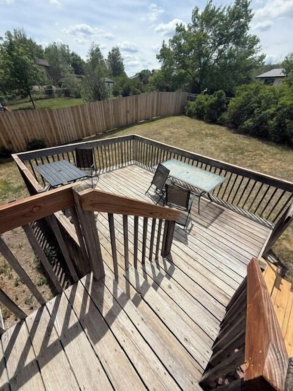 outside area has fully fenced yard and spacious deck