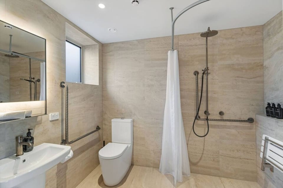 Spacious, fully accessible bathroom with walk-in shower
