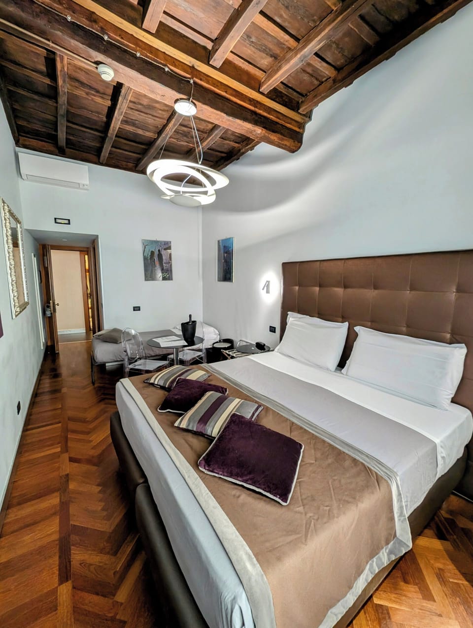 Triple Room, City View | Minibar, in-room safe, desk, blackout drapes