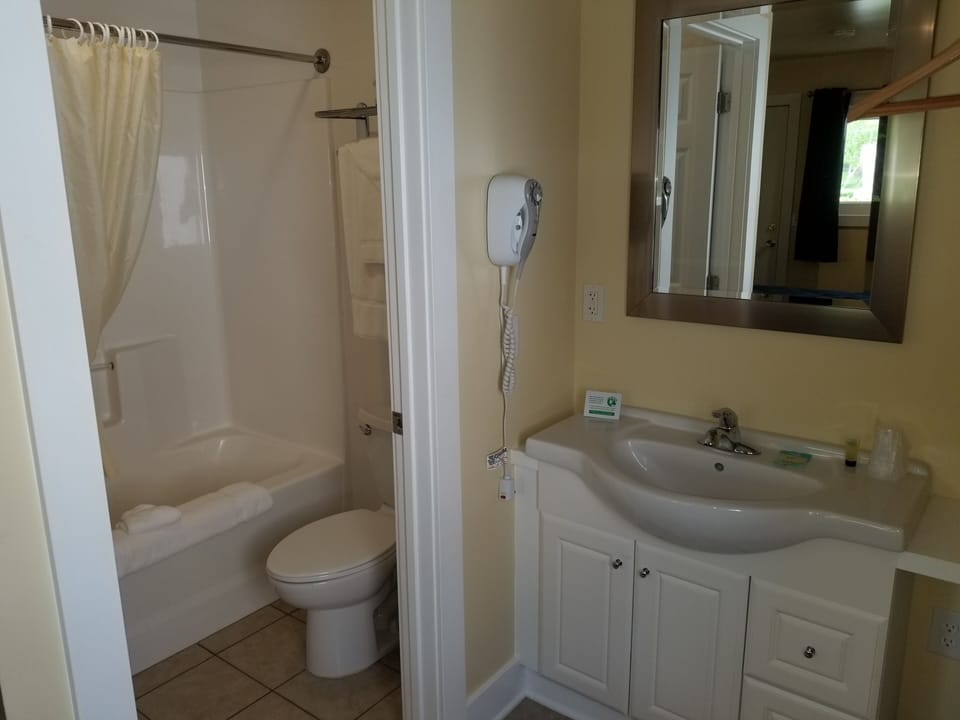 Economy Room | Bathroom | Combined shower/tub, hair dryer, towels, soap