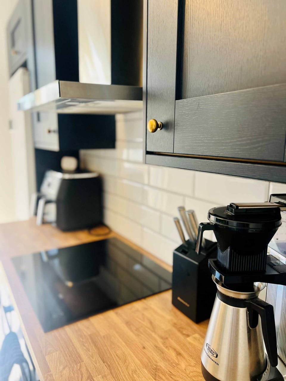 Kitchen with hob and extractor