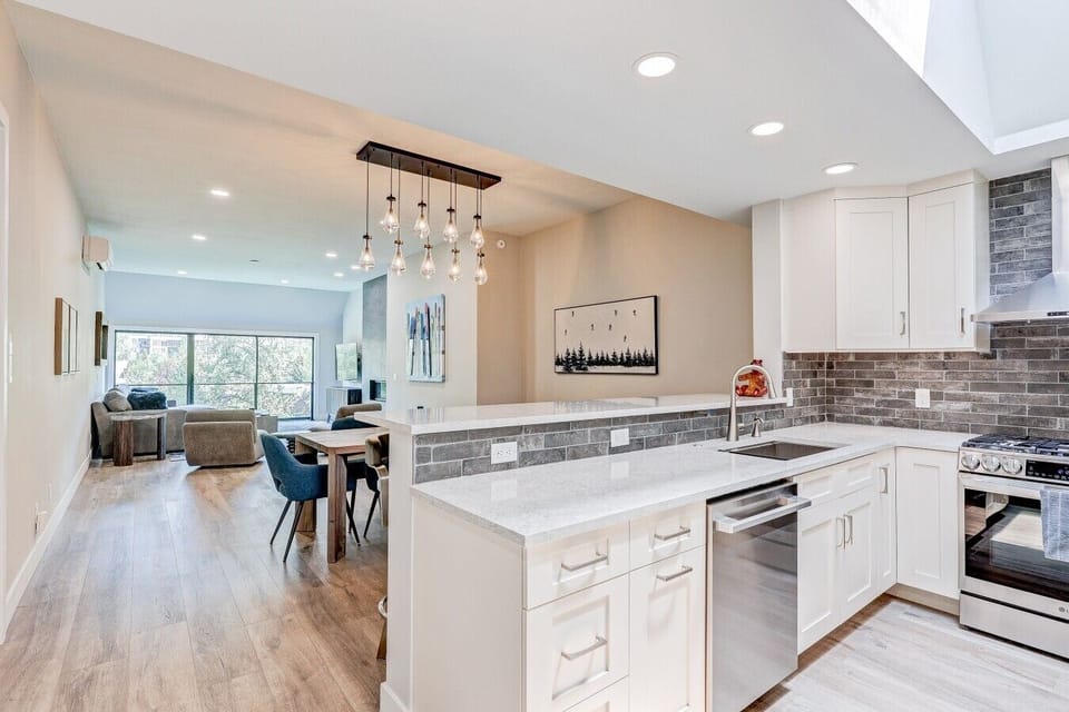 Kitchen w/ View into Living area