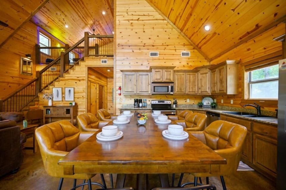 The large dining table and fully equipped kitchen make it easy to gather everyone together for memorable meals.
