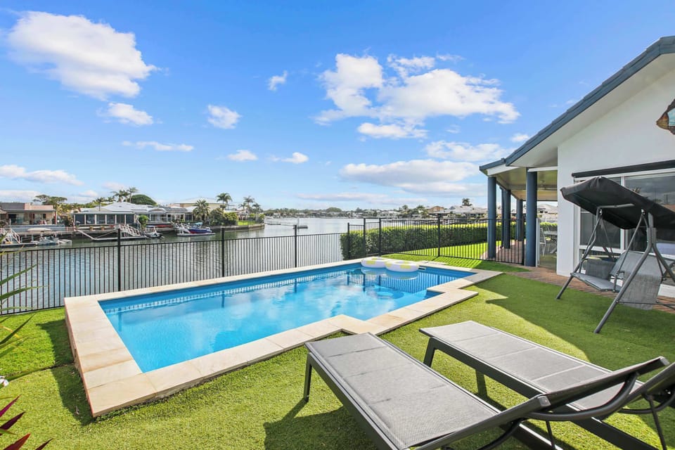 Sparkling private swimming pool overlooking the canal