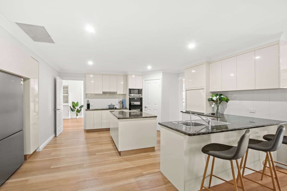 Modern kitchen overlooking the living and dining areas