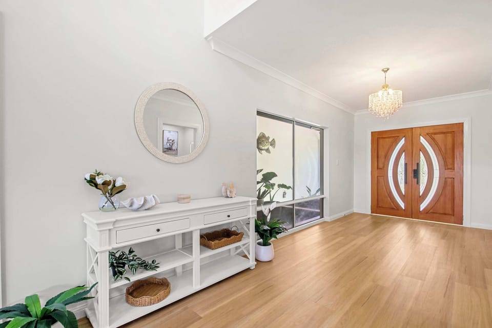 Grand entrance welcomes you into this spacious waterfront retreat