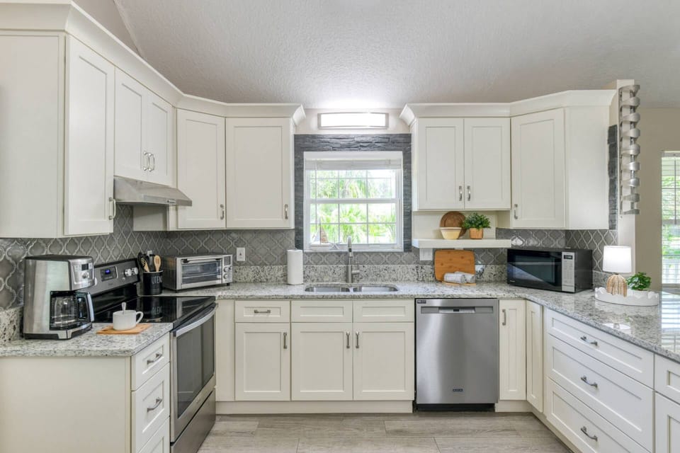 The modern kitchen is full-stocked with everything you need to prepare your favorite foods and drinks.