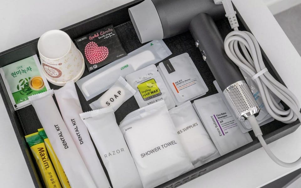Hair dryer, towels, shampoo, toilet paper