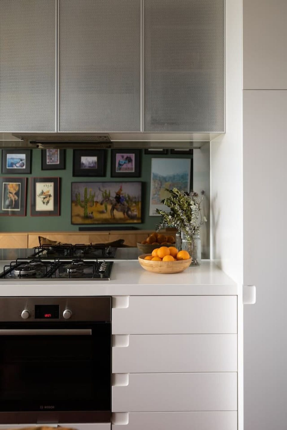 Whip up a delicious home-cooked meal in this fully equipped, modern kitchen—featuring sleek appliances, pristine countertops, and thoughtful designer touches.