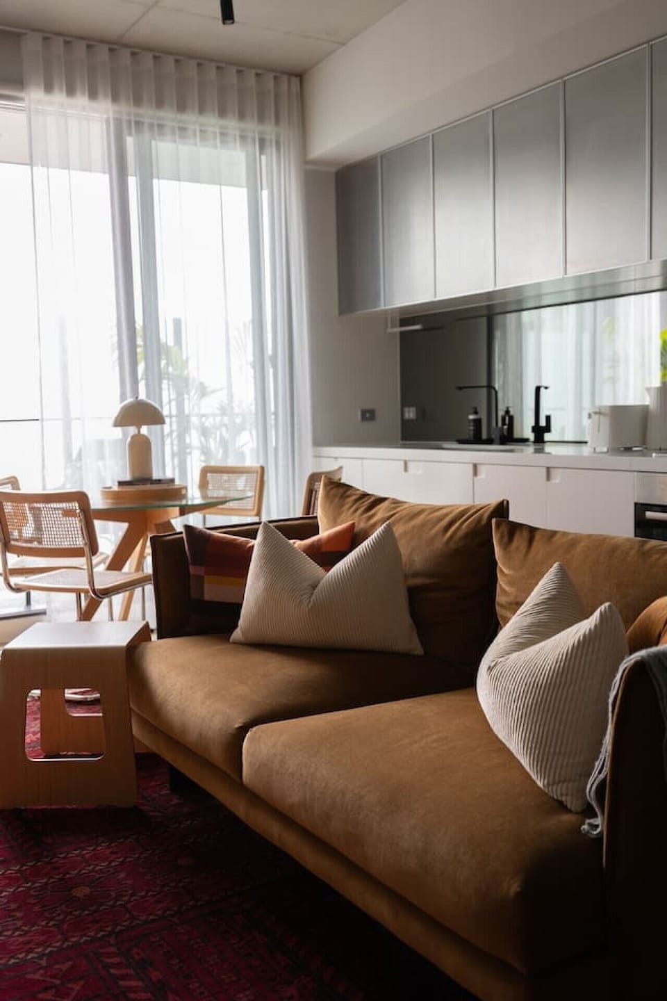 Sink into this ultra-comfortable plush sofa for a cozy movie night, or enjoy your morning coffee by the sunlit glass dining nook overlooking the balcony.