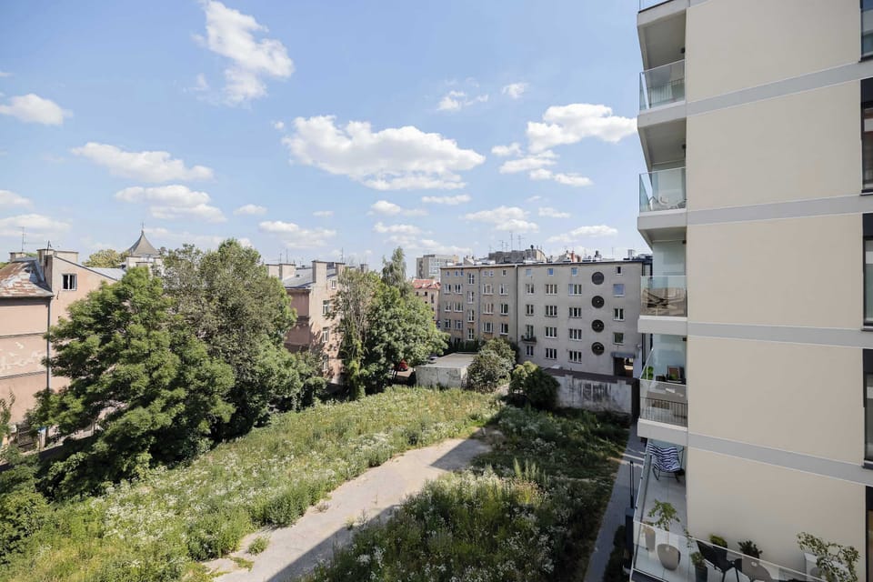 Enjoy a pleasant view of the surrounding neighborhood from the private balcony. It is a lovely spot to get some fresh air and relax.
