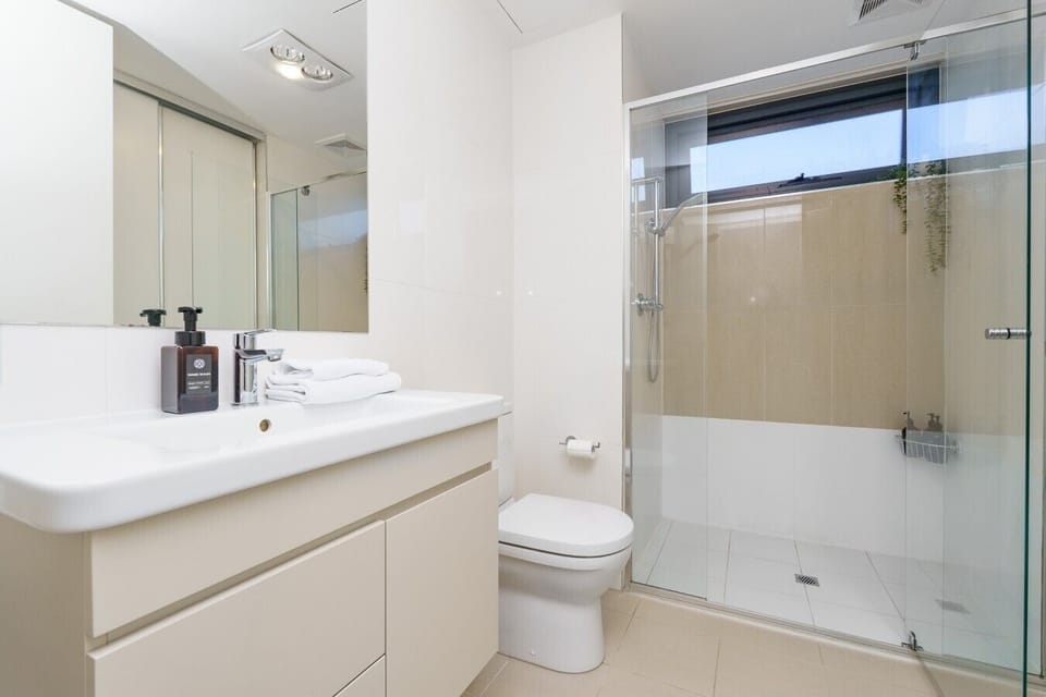 The sleek bathroom combines style and practicality, with everything you need for a comfortable stay.