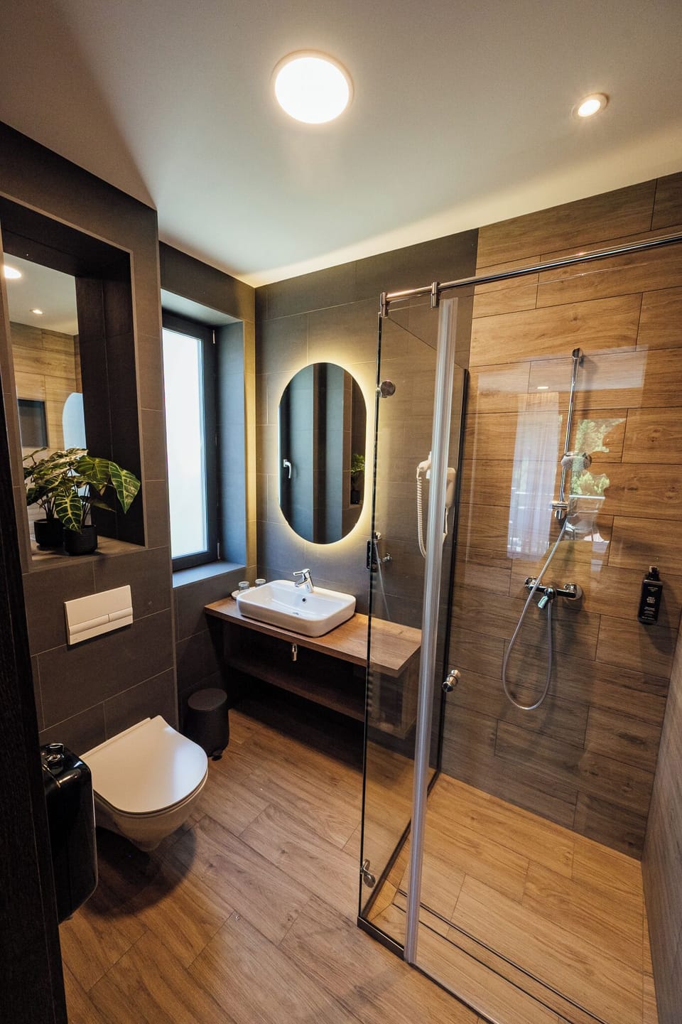Separate tub and shower, hair dryer, slippers, towels
