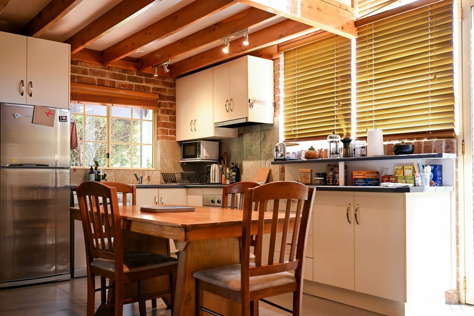 Plenty of room to share a meal. Opens to outdoor seating area & garden.