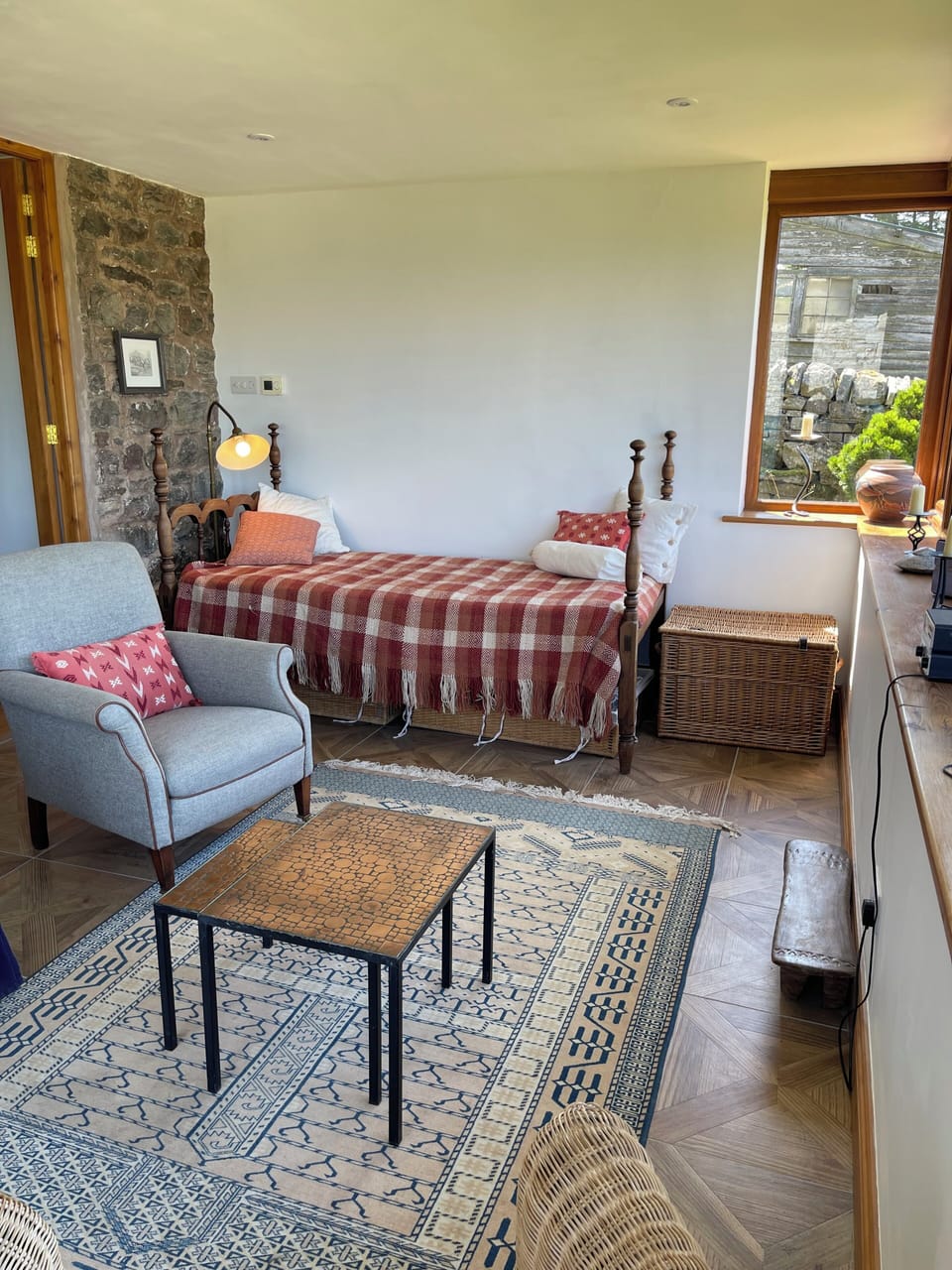 Antique daybed for an afternoon nap. Games & jigsaws are in the baskets.