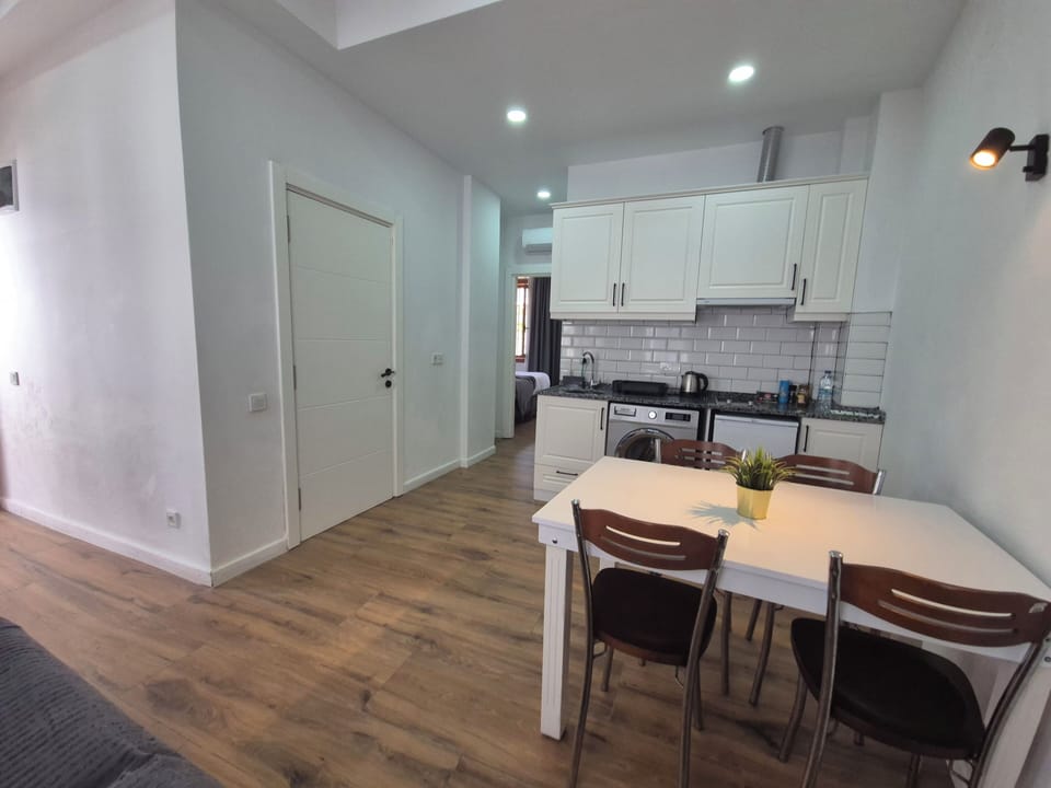Condo, 2 Bedrooms | Private kitchen | Stovetop, cookware/dishes/utensils, dining table