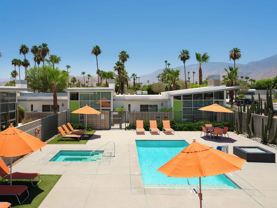 Relax poolside beneath spectacular Palm Springs sunset skies