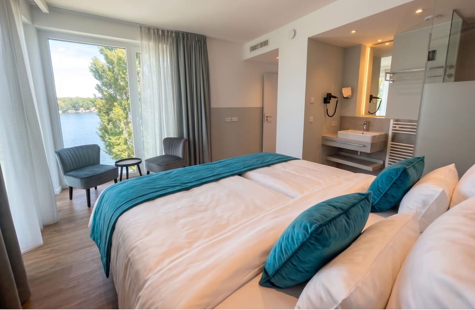 Deluxe Suite, Balcony | In-room safe, desk, laptop workspace, blackout drapes