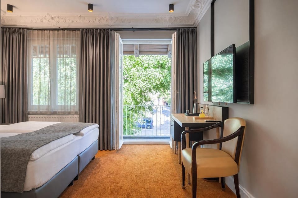 Comfort Double Room, Balcony, Garden View | Minibar (free items), desk, laptop workspace, soundproofing