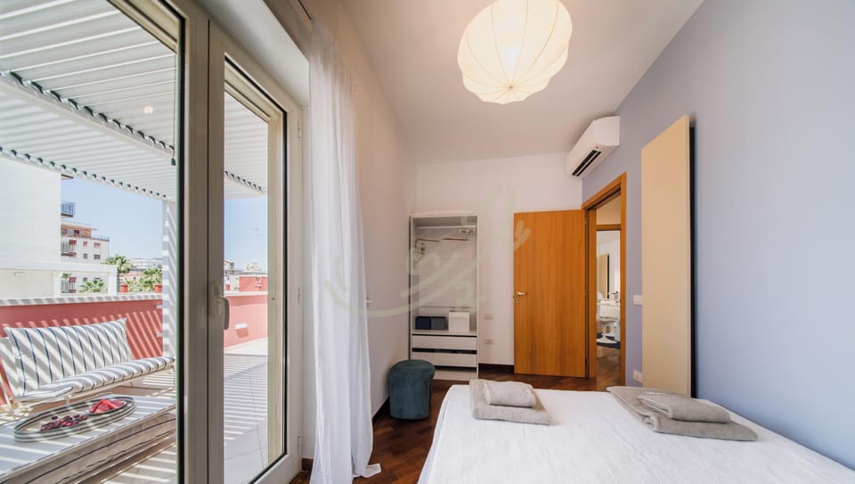 Apartment (2 Bedrooms) | Iron/ironing board, bed sheets