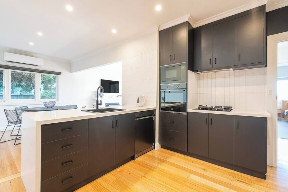 Cook with ease in the kitchen, where modern appliances, ample storage, and thoughtful finishes make preparing meals feel simple and enjoyable.