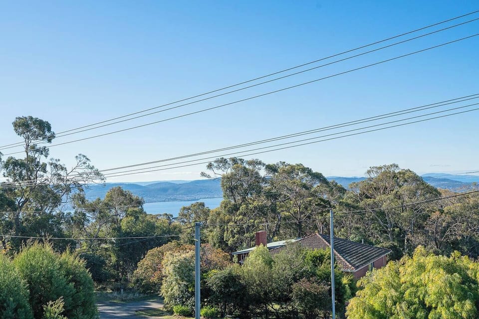 Pause on the upper deck as panoramic views stretch across the Derwent River and rolling hills, offering a memorable backdrop from sunrise to dusk.