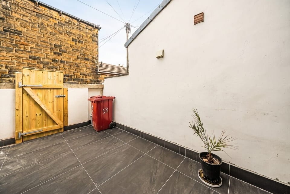 Enclosed rear yard with gated access and low upkeep charm