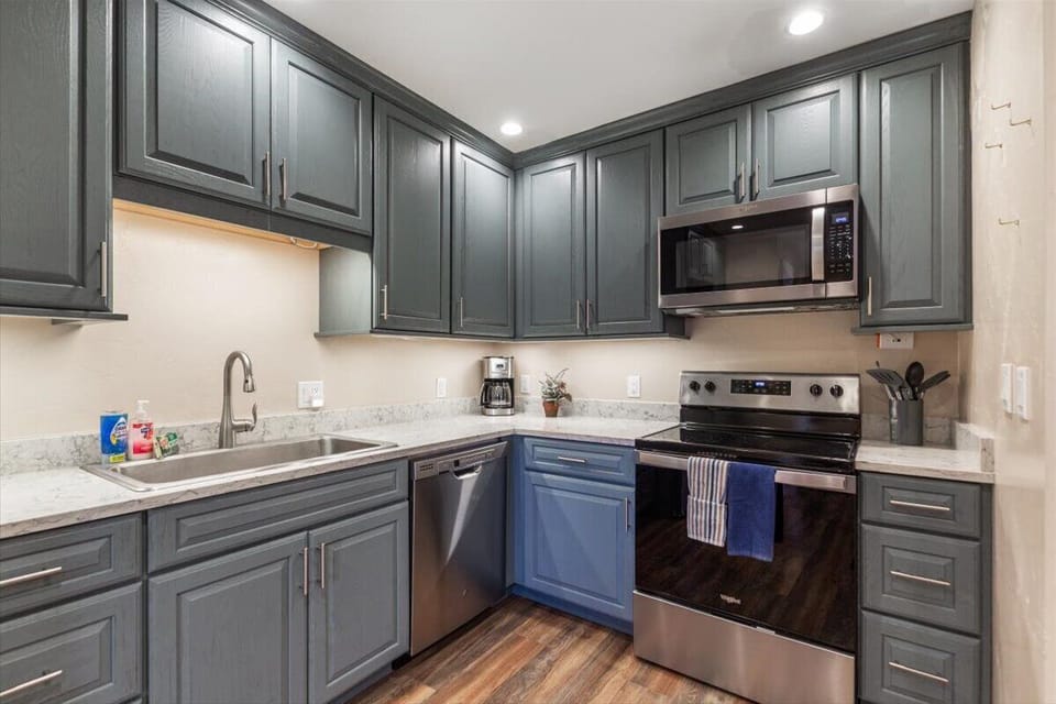 Modern kitchen with stainless appliances and ample cabinet space