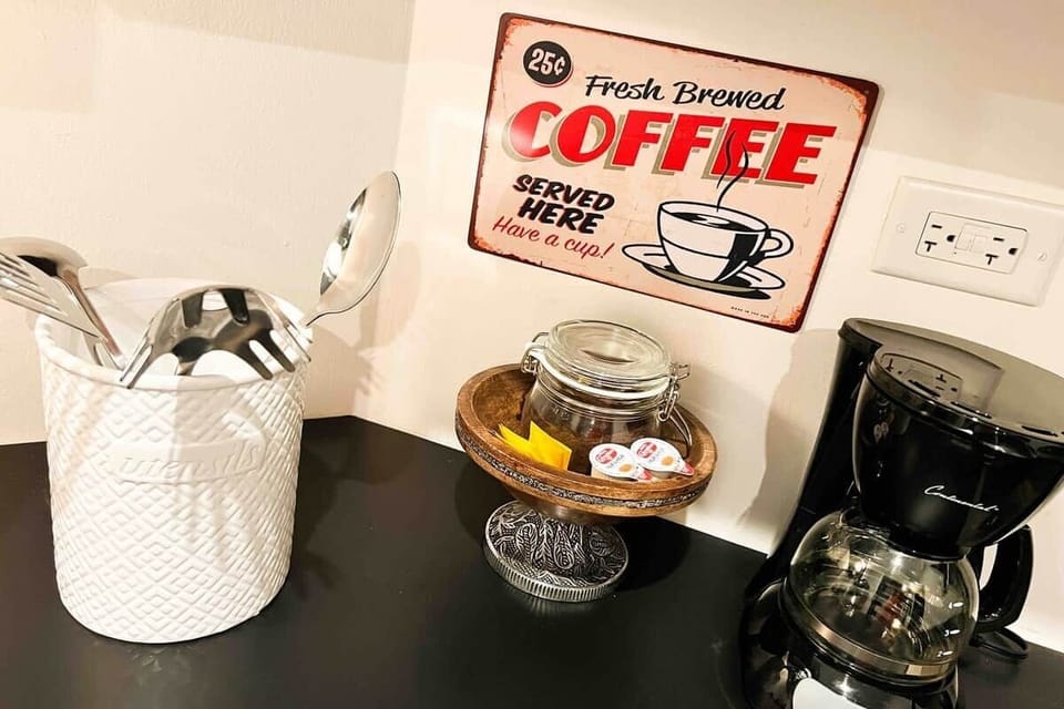 Savor a cup of our complimentary Oro Coffee, complete with sugar and creamer for your enjoyment.