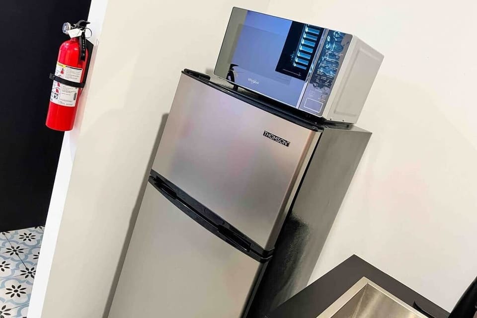 Our apartments feature a medium-sized refrigerator with ample space for your short-term stay. Additionally, we provide complimentary water upon your arrival.