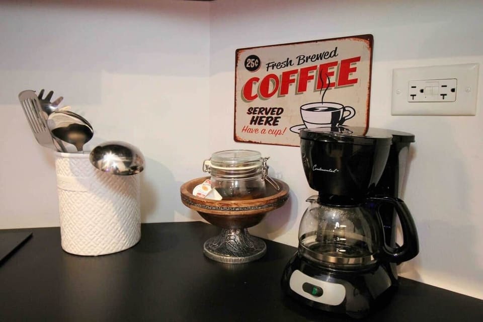 Savor a cup of our complimentary Oro Coffee, complete with sugar and creamer for your enjoyment.