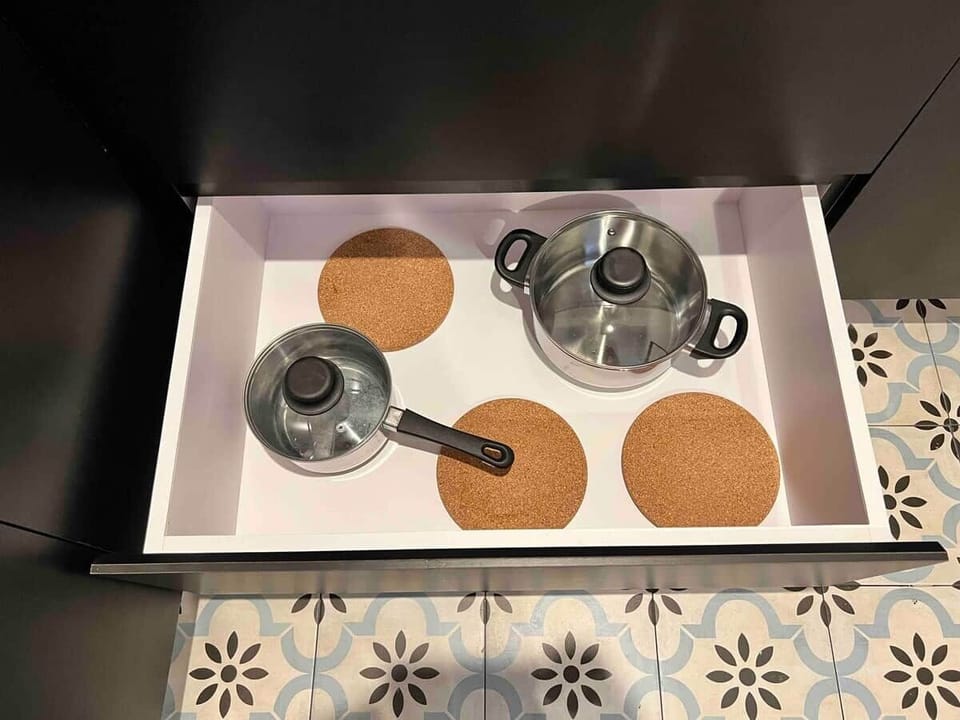 You'll find basic cooking tools like pans, pots, cutting boards, and more, all here for your convenience.