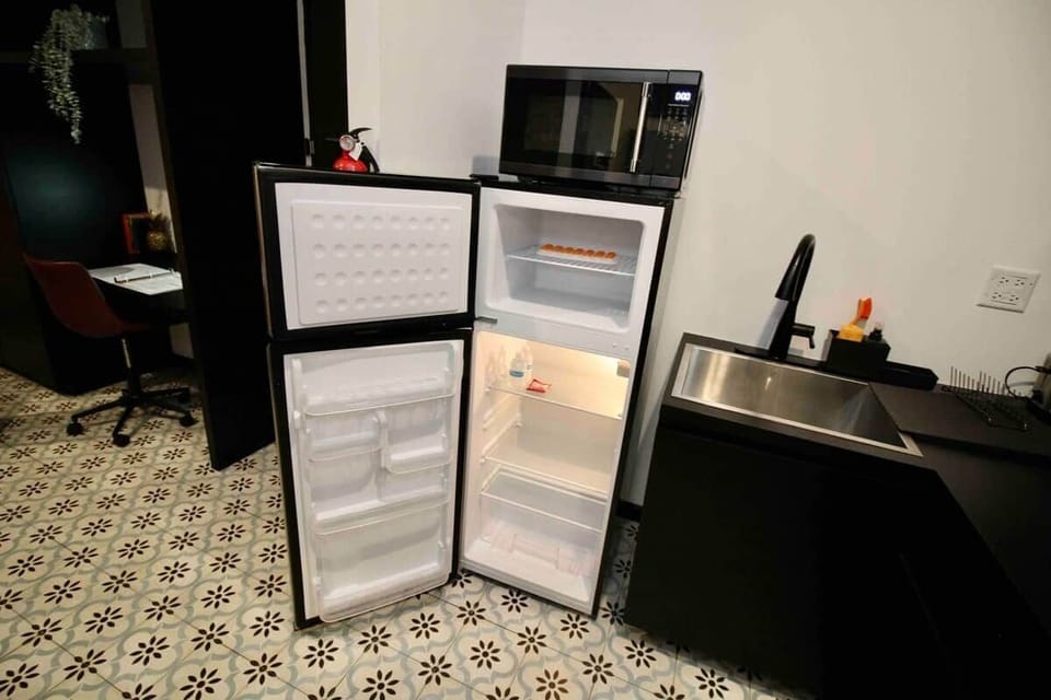 Our apartments feature a medium-sized refrigerator with ample space for your short-term stay. Additionally, we provide complimentary water.