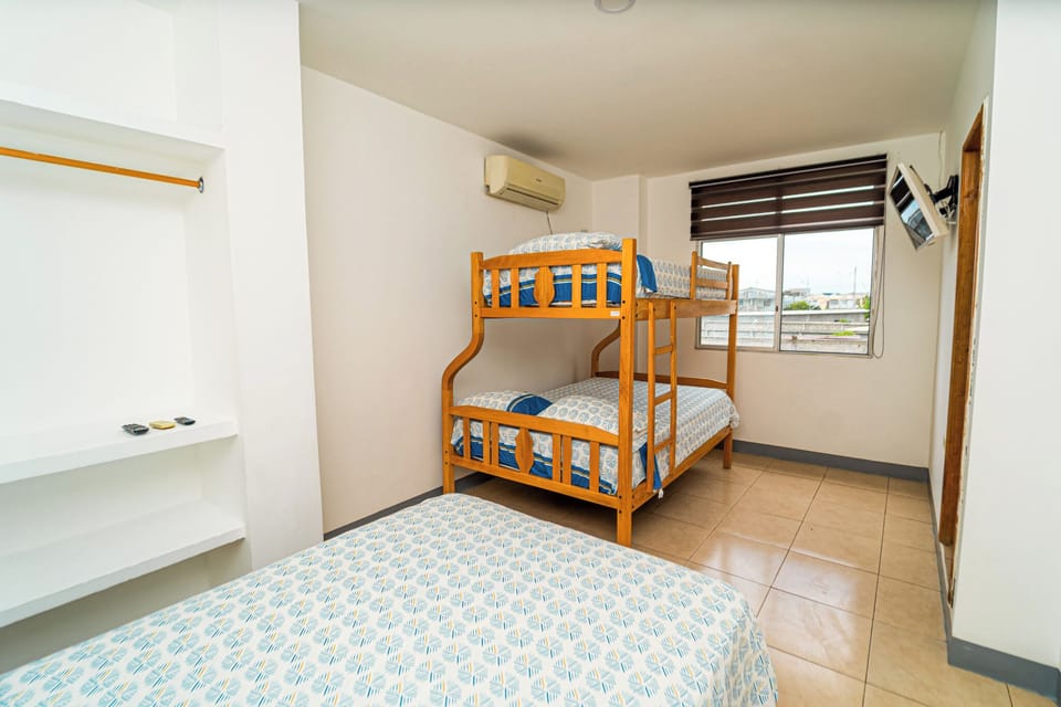 Family Quadruple Room, Air conditioning, City View | Laptop workspace, blackout drapes, iron/ironing board (on request)